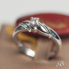 Anello solitario Damiani oro