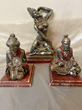 Sculture laminate in argento e