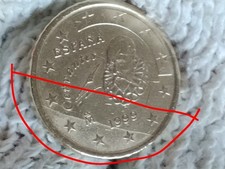 Moneta 50 cent Spagna 1999 è presente una striscia come "Materiale ricongiunto"