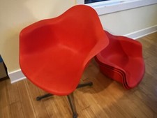 Sedia Herman Miller Charles Eames con braccioli arancione - autentica