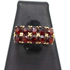 Anello fascetta con granati