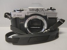 FOTOCAMERA REFLEX ANALOGICA A PELLICOLA 35 mm.  MINOLTA X-300 GUASTA DA RIPARARE