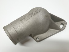 Gomito di scarico caricatore