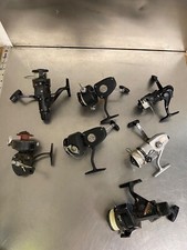 Lotto di 7 mulinelli da pesca vintage a faccia aperta