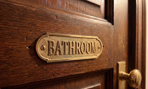 Insegna porta bagno ottone