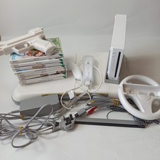 Nintendo Wii Family Bundle - Console, 8 giochi, Balance Board, Controller