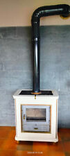VENDUTA. Stufa a legna Piazzetta modello 904, ghisa e ceramica, 10 kW. 