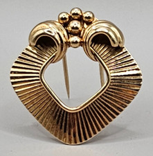 Antica spilla Cartier oro