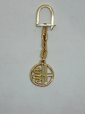 Portachiave Alfa Romeo, in oro 18K.-750. Peso Gr. 27,20