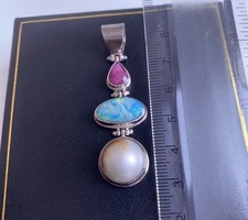 Ciondolo doppiopetto e perle