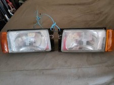 COPPIA FARI FANALI ANTERIORI VOLKSWAGEN POLO 2°SERIE 81/94 HELLA