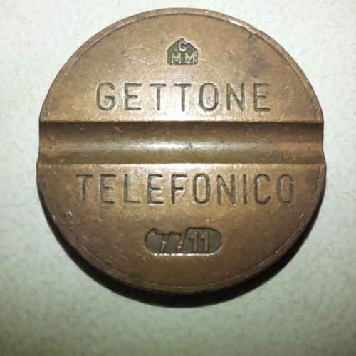Gettone telefonico 7711 con - 7711,