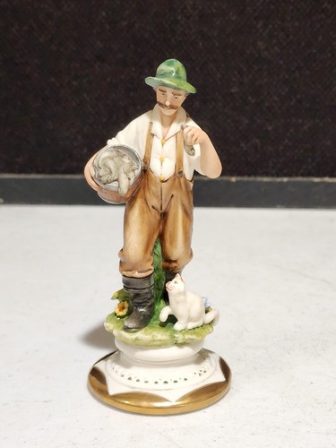 Figurina uomo con - figurina, pesce