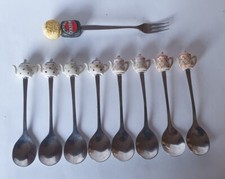 Set 8 cucchiaini  1 forchettina da caffè,dolce,caraffine in testa,nuovi  vintage