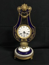 Elegante Orologio Impero in Porcellana di Limoges