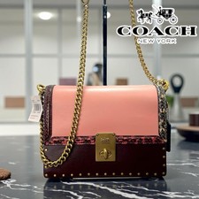 Borsa a tracolla Coach Jennifer Lopez collaborazione pelle di serpente catena marrone rosa Nea
