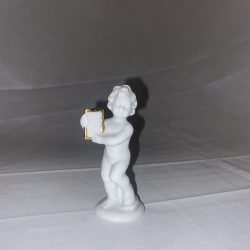 Statuetta bambino con - , libro