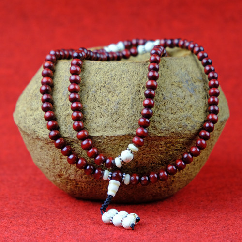 Collana legno rosa - in,