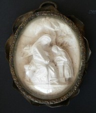 Antico ovale con scultura in