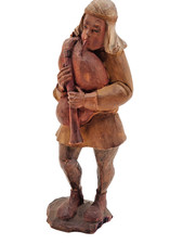 Uomo che gioca la cornamusa -