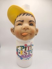 Testa di bambino in gomma con cappello giallo, biberon in plastica, Spagna, Piti Gestos, Joimy