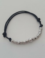 BRACCIALE NERO CON PEPITE GRANELLI ARGENTO 925 