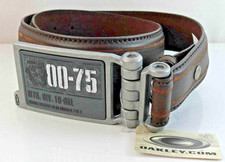 CINTURA OAKLEY PELLE NERA 00-75 CREST FIBBIA PIASTRA CINTURA PICCOLA UNISEX NUOVA CON ETICHETTE RARA