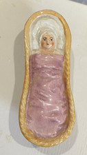 Antica culla in ceramica