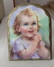 Quadro in legno con bambino e Padre Pio