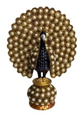 Statua pavone ingioiellato