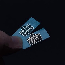 Adesivo logo metallo