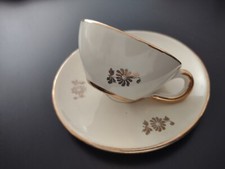 Tazzina antica in ceramica con disegni in oro zecchino.