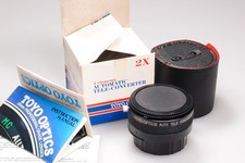 TELECONVERTITORE TOYO OPTICS 2X COME NUOVO CON SCATOLA. ADATTO A TAPPI/CUSTODIA NIKON AI INCLUSI