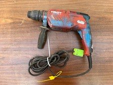 Trapano a percussione rotativo