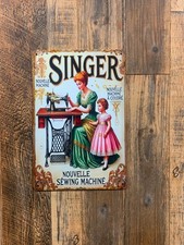 Insegna in metallo, Singer