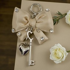 CIONDOLO FORMA FIOCCO