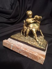 Putti chevrier en bronze et