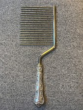 Affettatrice forchetta pettine