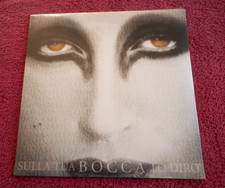 Mina sulla tua - tua, bocca