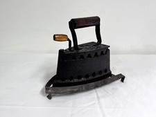 Ferro da stiro a braci ardenti