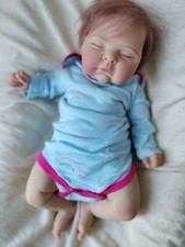 Bambola neonato pesata pesche