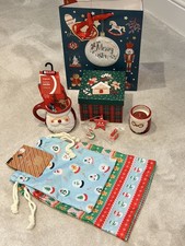 Candela e tazza Babbo Natale