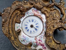 Orologio In Bronzo E Smalto Decorato Con Puttini E Fiori. Vienna, Fine XIX Sec