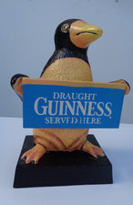 Draught 6 1/2" GUINNESS SOLD HERE Advertising Sign held by a Toucan.