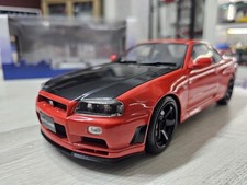 Nissan Skyline GT-R (R34) 1999 Rosso/nero 1:18 Solido
