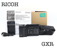 Corpo fotocamera digitale Ricoh GXR con caricatore, batteria e manuale ottimo