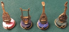 Quattro Miniature di Strumenti Musicali in Argento Massiccio