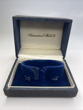 Orologio vintage IWC International scatola interna nera e oro con interno blu e avorio