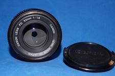 Canon FD 50 mm f 1.8,  tappi