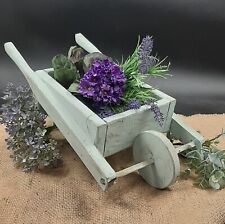 Piccola carriola in legno porta vaso